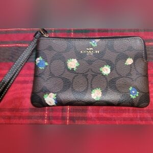 Coach Corner Zip Wristlet in signature coated canvas with a floral